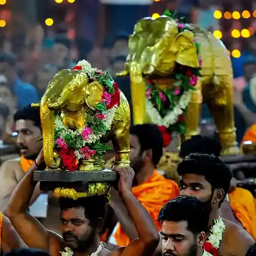 Traditional Kerala temple utsavam in Kottayam with lamps and decorations
